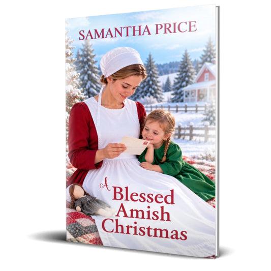 A book cover for 'A Blessed Amish Christmas' by Samantha Price, featuring a snowy outdoor scene with an Amish woman in a white apron and bonnet reading to a young girl in a green dress. The book is shown standing upright against a white background with a soft shadow.