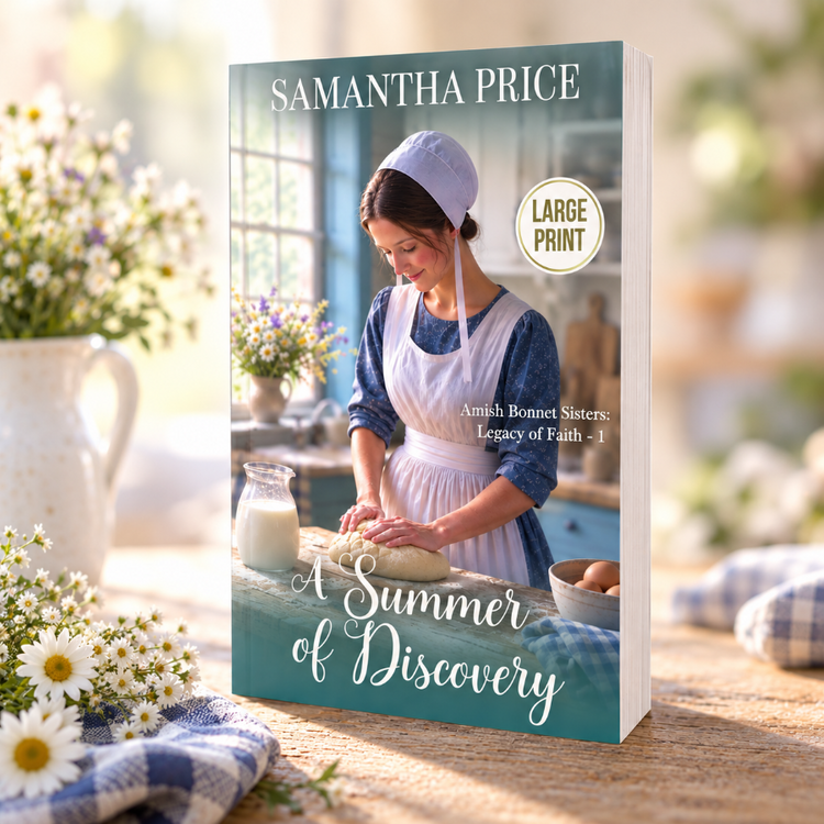 A large print paperback book titled 'A Summer of Discovery' by Samantha Price, standing upright on a wooden table. The book cover features a vintage-style photograph of an Amish woman kneading dough in a sunlit kitchen.