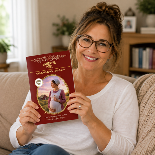 a woman holding large print amish widow's first love book by samantha price